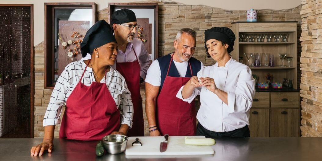 Skilled Chef Teaching a Group of Seniors in Assisted Living Facility