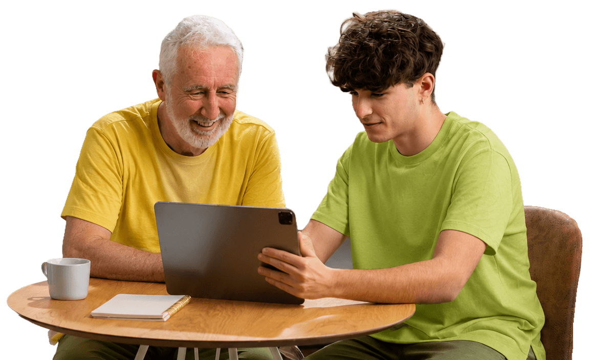 Elderly Man Enjoying Tablet Time with Grandson in Independent Living Community Elderly Man Enjoying Tablet Time with Grandson in Independent Living Community
