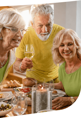 Elderly Friends Sharing Wine and Appetizers at a Dinner in Independent Living Elderly Friends Sharing Wine and Appetizers at a Dinner in Independent Living