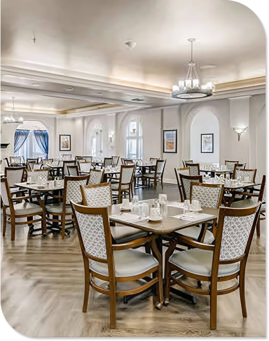 Elegant Dining Hall with Chandeliers and Table Settings in Independent Living Community Elegant Dining Hall with Chandeliers and Table Settings in Independent Living Community