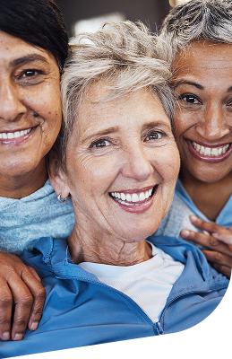 Three Elderly Women Smiling Together Outdoors in Independent Living Community Three Elderly Women Smiling Together Outdoors in Independent Living Community