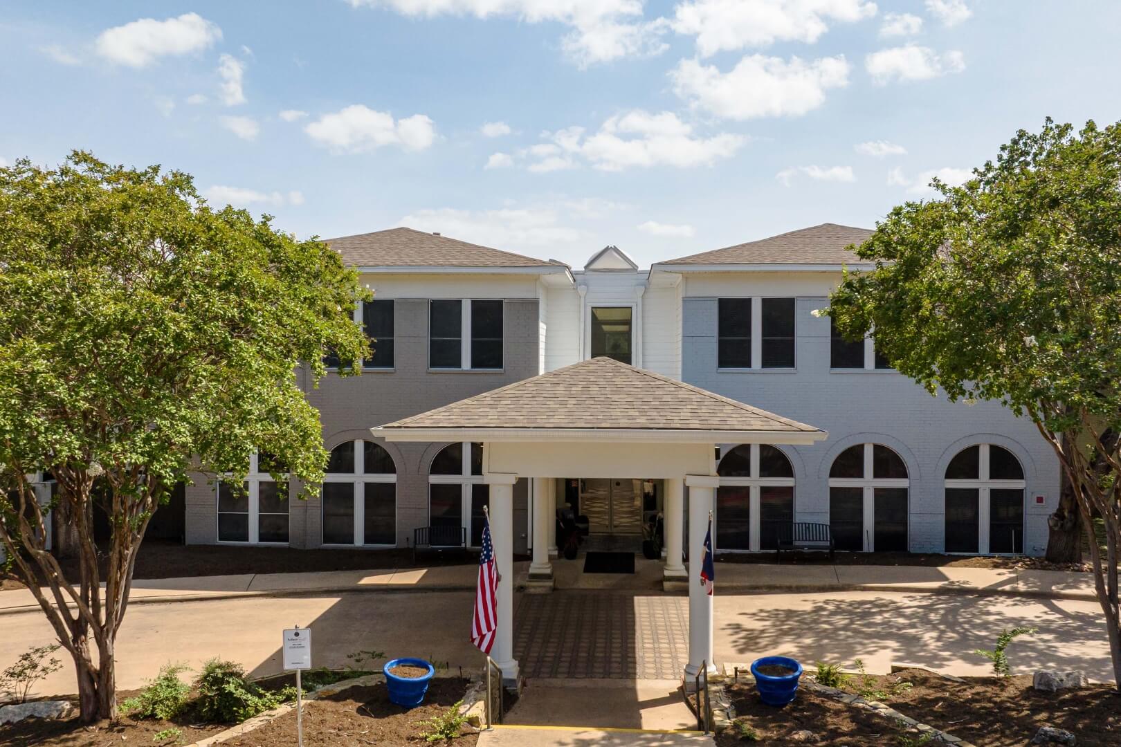 Welcoming Front Entrance With Covered Portico at an Independent Living Facility
