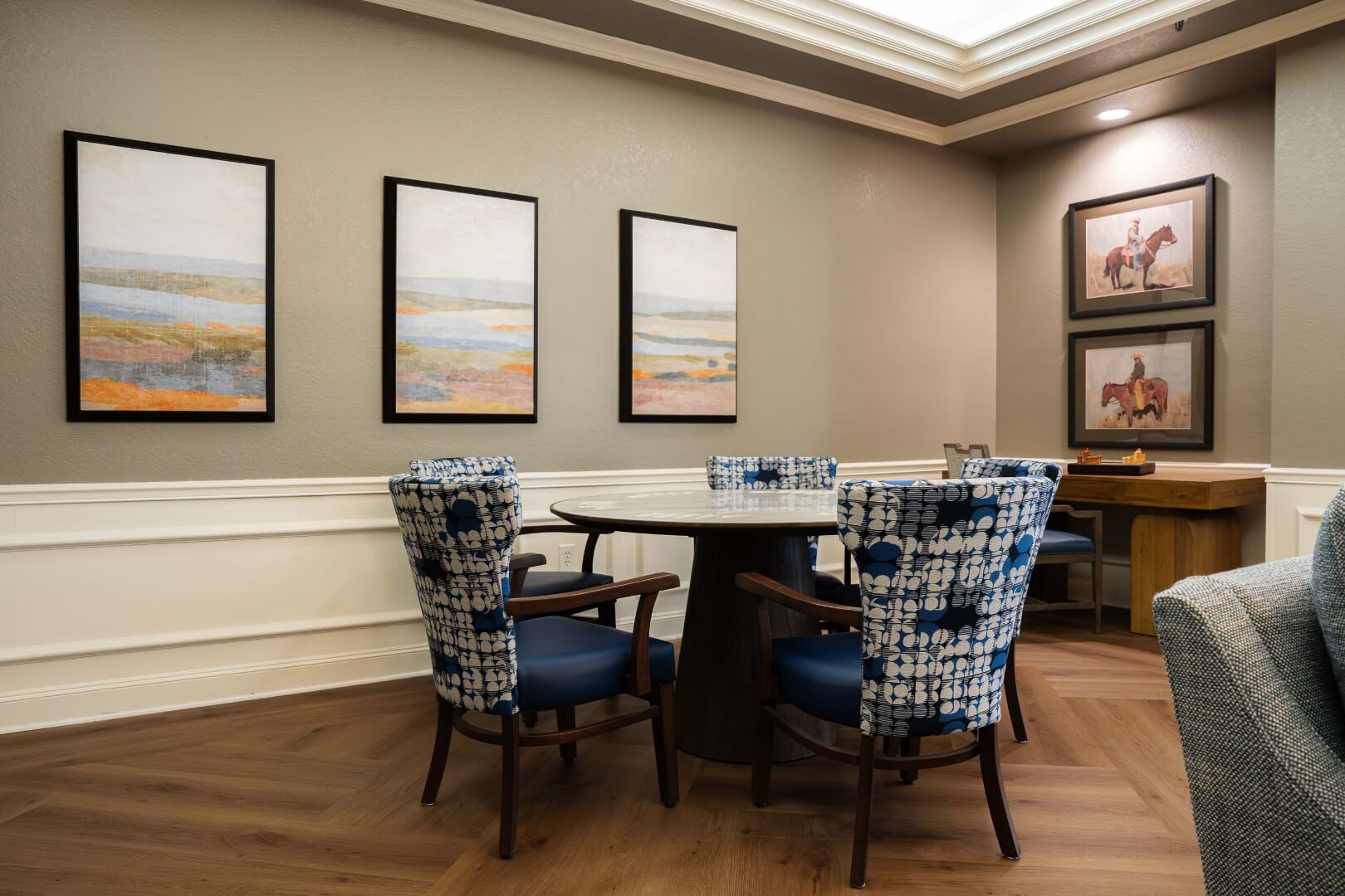Card Table With Patterned Chairs and Artwork in an Assisted Living Facility
