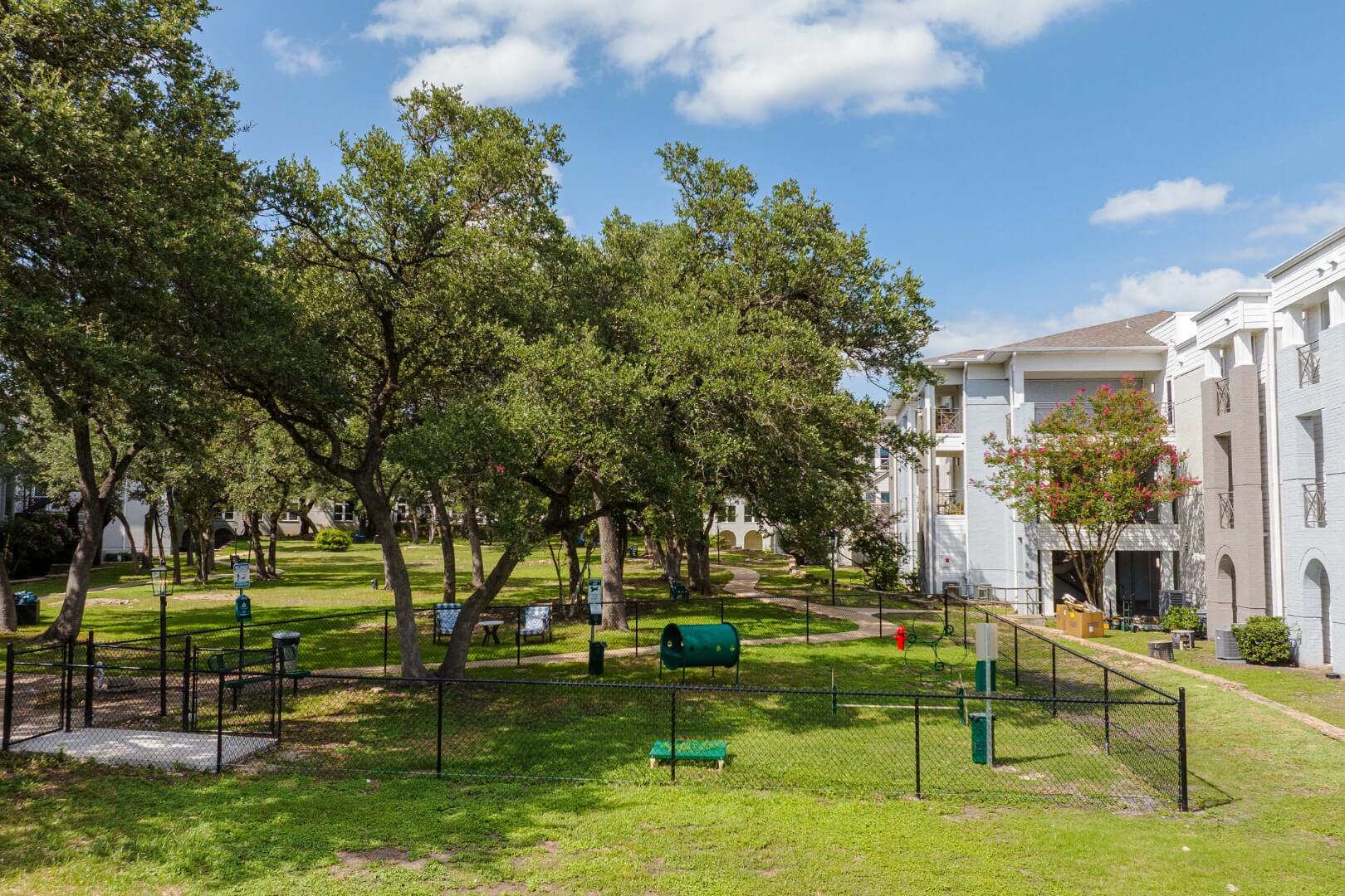 Fenced Dog Park With Agility Equipment at an Assisted Living Facility