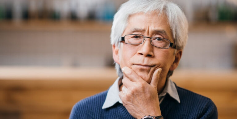 Elderly Man Deep in Thought at Assisted Living Facility