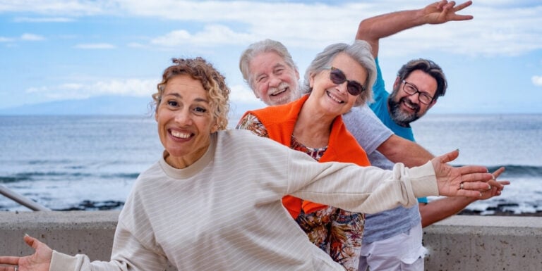 Elderly Friends Posing Joyfully Together near Independent Living Facility