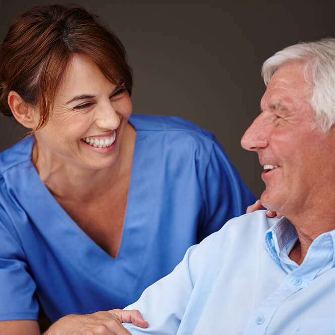 Caregiver Comforting Resident at Assisted Living Facility